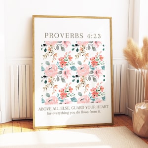 May include: A printable wall art design with a floral pattern in shades of pink, peach, and green. The text "PROVERBS 4:23 ABOVE ALL ELSE, GUARD YOUR HEART for everything you do flows from it." is printed on the design.