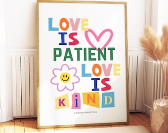 May include: A framed art print with the words "LOVE IS PATIENT LOVE IS KIND" in colourful block letters. A pink heart and a smiling daisy are also featured. The Bible verse 1 Corinthians 13:4 is printed at the bottom.