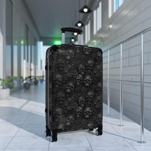Black Flowers and Skulls Suitcase! Hard side, rolling luggage with black skulls and flowers.Gothic, Skulls, black luggage!  Skull suitcase!