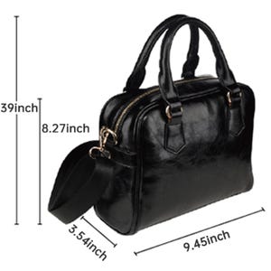 May include: Black satchel bag with a glossy finish. The bag has two top handles and a detachable shoulder strap. Dimensions are 13.39 inches high, 9.45 inches wide, and 3.54 inches deep. The bag features gold-colored hardware and a zipper closure.