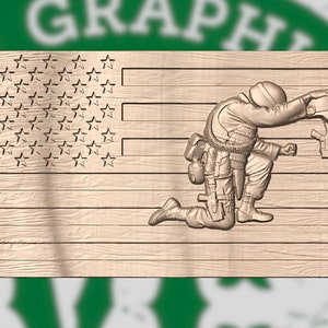 May include: A wooden carving depicting a kneeling soldier with a helmet and rifle, set against the American flag. The flag shows stars and stripes, with the soldier's figure in a detailed, three-dimensional relief.