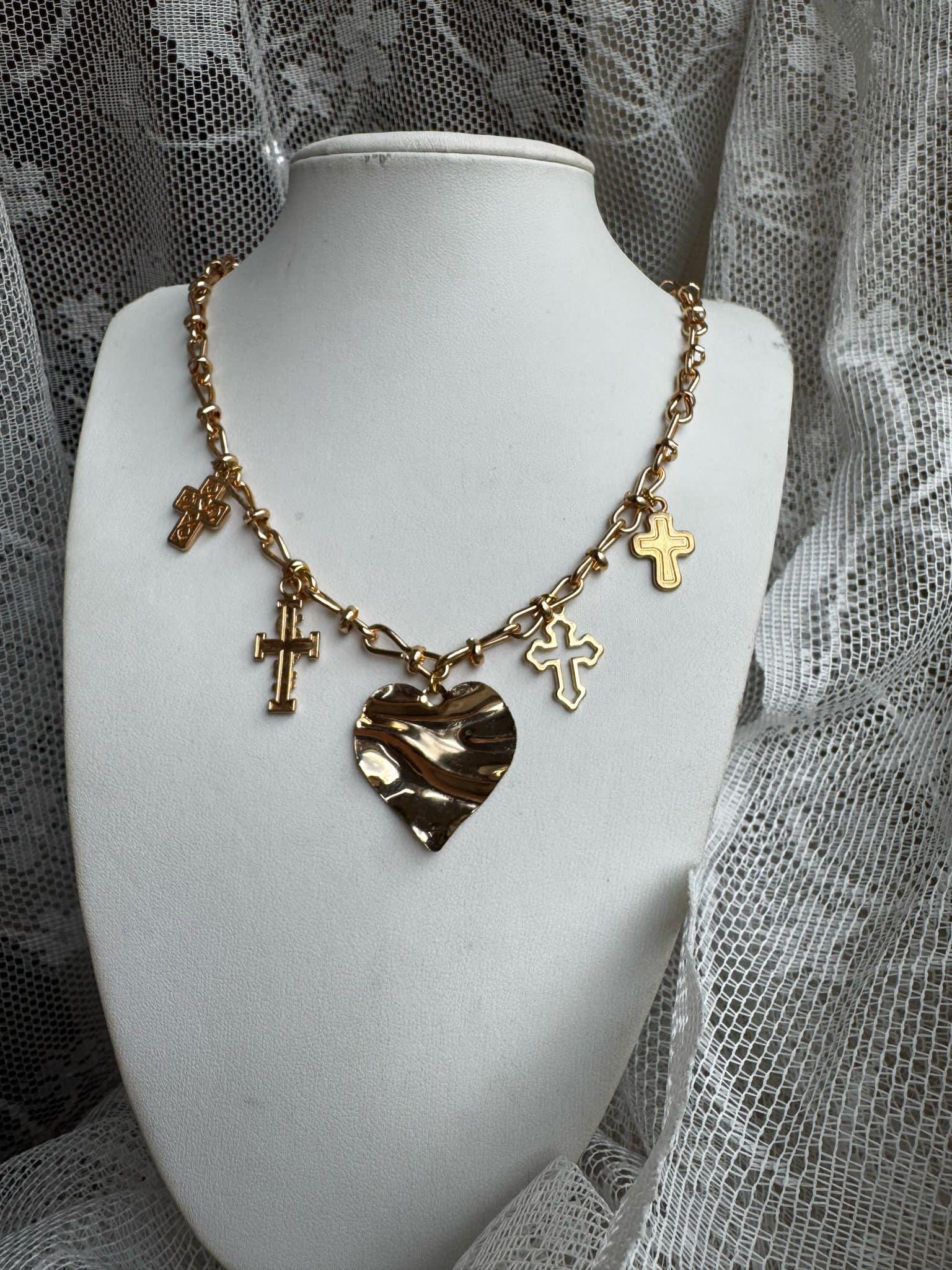 Golden chain with heart and crosses