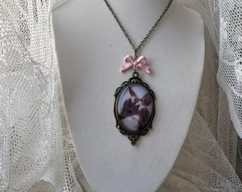 Chain with pink bow and a cameo of a deer