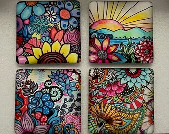 May include: Four square magnets with colorful floral and landscape patterns inside a silver metal tin. The lid features the text M MAGNET MARKETPLACE and magnetmarketplace.etsy.com. Each magnet displays intricate, vibrant, hand-drawn style designs.