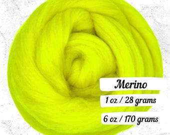May include: A vibrant, neon yellow merino wool roving. The image shows a tightly wound bundle of wool, with the word "Merino" and weight information: 1 oz / 28 grams and 6 oz / 170 grams.