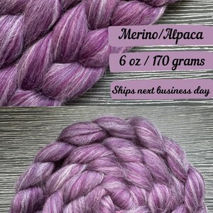 May include: Purple and white merino and alpaca fiber roving, 6 ounces or 170 grams.