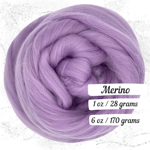 May include: A large, tightly wound bundle of soft, lavender-colored Merino wool roving. The image includes text that reads "Merino", "1 oz / 28 grams", and "6 oz / 170 grams". This wool is ideal for various fiber art projects.