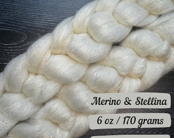 May include: White merino wool yarn with silver shimmer, braided into a thick rope. 6 oz / 170 grams.
