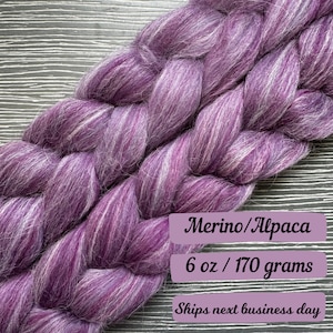 May include: Purple and white merino wool and alpaca fiber roving, 6 ounces or 170 grams. Ships next business day.