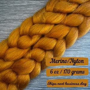May include: A braided skein of golden brown merino wool yarn with nylon for added strength. The yarn is 6 ounces or 170 grams. Merino/Nylon 6 oz / 170 grams Ships next business day
