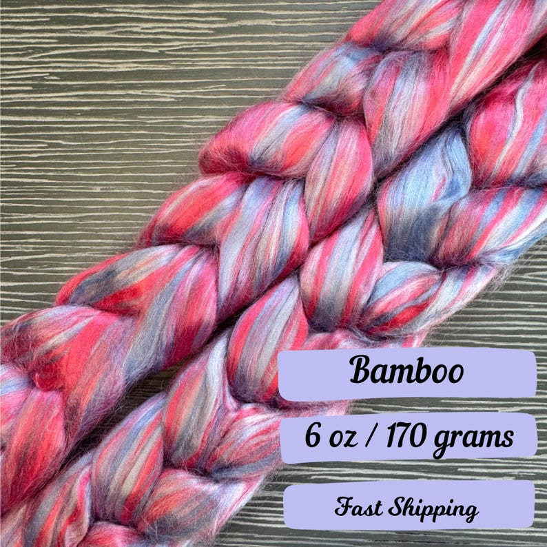 Pode incluir: Uma tran&ccedil;a de fio de bambu rosa, azul e branco. O fio pesa 6 on&ccedil;as ou 170 gramas.