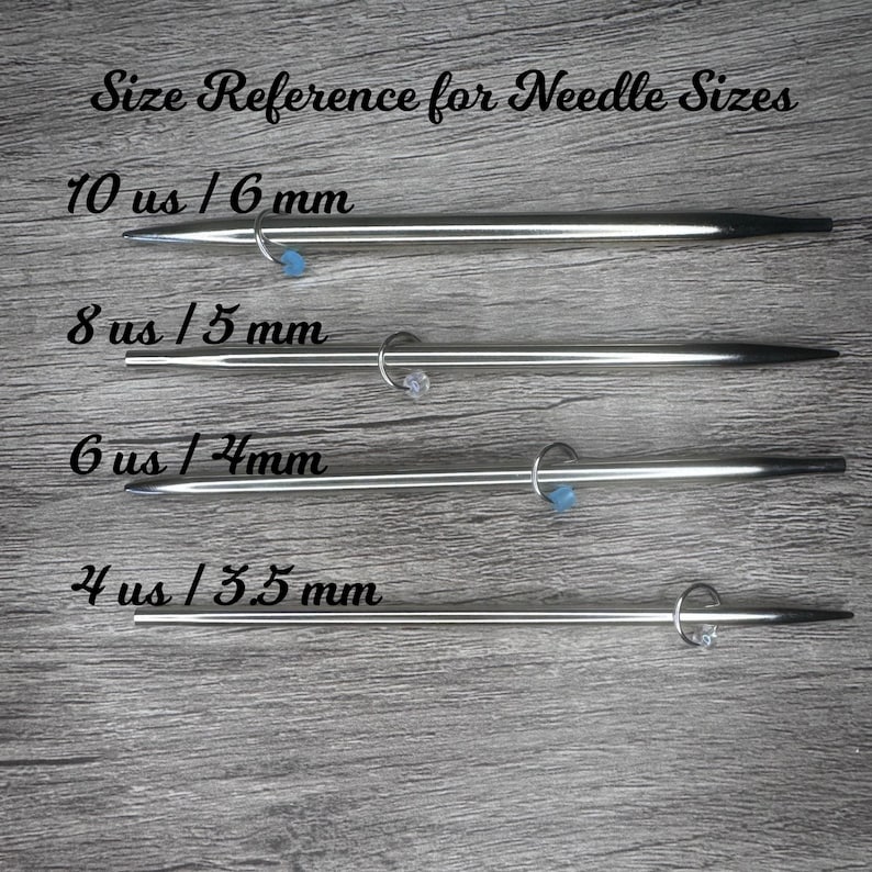 May include: Image of four silver knitting needles with size references: 10 us / 6 mm, 8 us / 5 mm, 6 us / 4 mm, and 4 us / 3.5 mm. Each needle has a small ring with a blue bead. The text "Size Reference for Needle Sizes" is at the top.