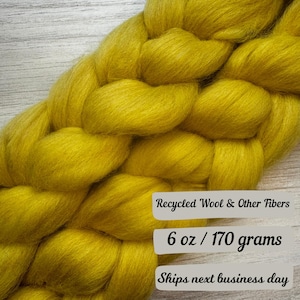 May include: A braided bundle of yellow recycled wool and other fibers, weighing 6 ounces or 170 grams.