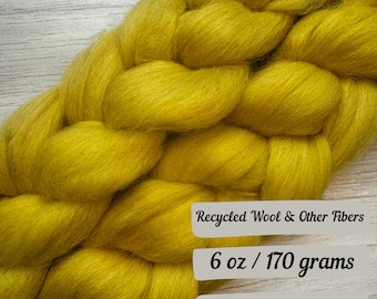 Può includere: Un fascio intrecciato di lana riciclata gialla e altre fibre, con un peso di 170 grammi (6 once).