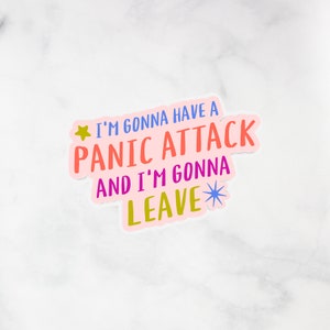 May include: A pink sticker with the text "I'm gonna have a panic attack and I'm gonna leave" in colourful letters. A yellow star and a blue star are on either side of the text.