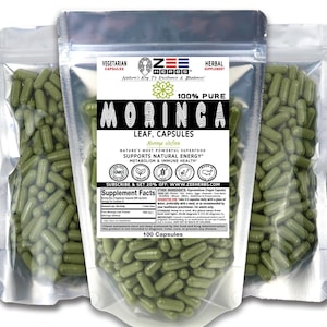 May include: Three silver foil pouches filled with green Moringa leaf capsules. The front label features the Zee Herbs logo, the text 100% Pure Moringa Leaf Capsules, and a supplement facts table. Each pouch contains 100 vegetarian capsules.