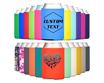May include: A variety of colorful can coolers with different designs. Some coolers feature a camouflage pattern, a heart with a shark design, and a hexagon with the text "CUSTOM TEXT".