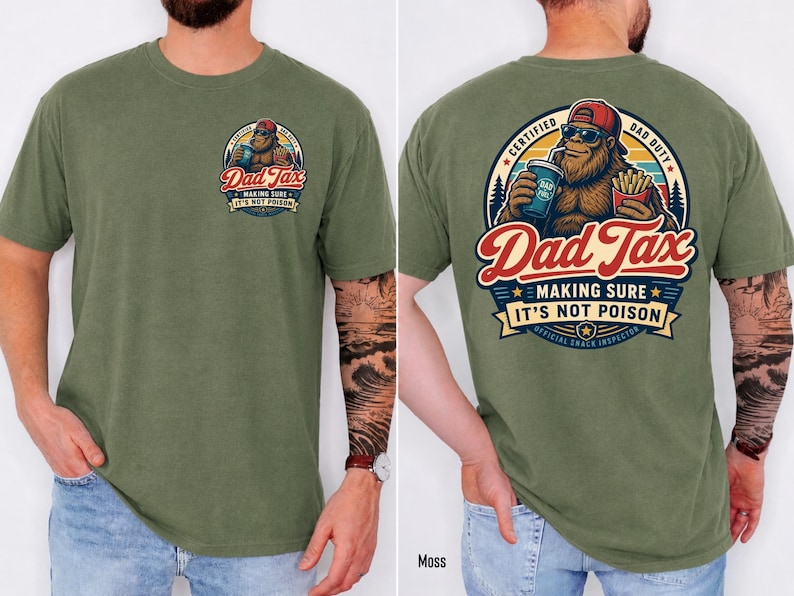 May include: Moss green t-shirt with a Bigfoot graphic. The graphic reads "Dad Tax" with the text "Making Sure It's Not Poison." The back of the shirt has a larger graphic with the text "Certified Dad Duty" and "Official Snack Inspector."