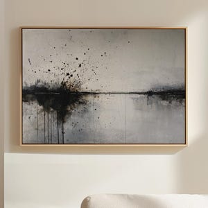 May include: A set of three ceramic mugs with a speckled, matte finish. The mugs are in shades of cream, light gray, and dark gray. Each mug has a simple, minimalist design and a rounded handle.