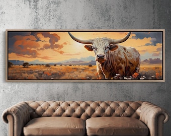 May include: A framed painting of a white longhorn steer standing in a field with a sunset in the background.
