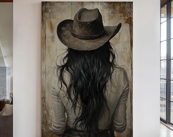 May include: A painting of a woman with long dark hair wearing a brown cowboy hat. She is facing away from the viewer and is wearing a white shirt. The painting is on a wooden background.