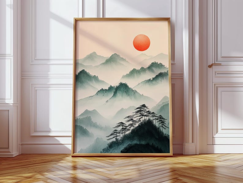 This Japanese sumi-e mountain print features a misty landscape with a bold red sun, evoking serenity and zen aesthetics. Inspired by traditional brush painting, this minimalist Asian wall art is perfect for meditation spaces, wabi-sabi interiors, and tranquil home decor.