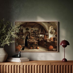 May include: A framed print depicts a witch's kitchen scene with pumpkins, a black cat, and a person in a black robe and hat. The kitchen is filled with wooden shelves, tables, and various cooking items. A burgundy lamp sits on a wooden cabinet.