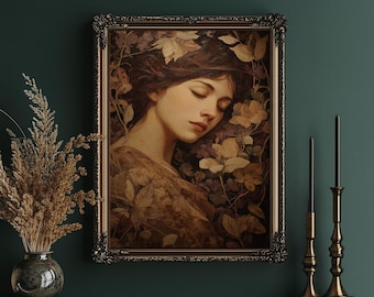 May include: An antique-style framed portrait of a woman with closed eyes, surrounded by floral elements. The artwork features a warm color palette with gold and brown tones. The frame is ornate and gold-colored, adding to the vintage aesthetic.