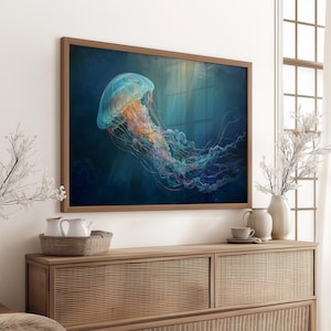 May include: A framed art print featuring a vibrant jellyfish in shades of blue, orange, and purple. The artwork is set against a dark blue background, creating a sense of depth. The print is displayed above a wooden cabinet.