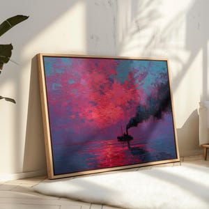 May include: A framed canvas print of a seascape with a ship. The artwork features a vibrant sky with shades of red, pink, and teal, reflecting on the water. A ship with black smoke is in the center. The frame is made of light-colored wood.