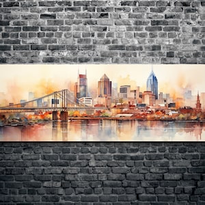 Op de afbeelding: Een aquarel schilderij van een skyline met een brug op de voorgrond. De gebouwen zijn in tinten bruin, oranje en geel, en de lucht is zachtblauw. Het water is diepblauw, en de reflectie van de stad is zichtbaar in het water.