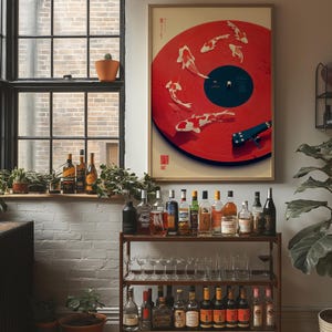 May include: A framed art print featuring a red vinyl record design with koi fish swimming across it. The artwork is displayed above a bar cart filled with various bottles of liquor and glassware, set against a brick wall.