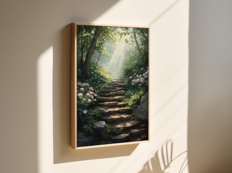May include: A framed painting of a stone pathway leading up a hill through a lush green forest. The path is lined with white flowers and sunlight streams through the trees.