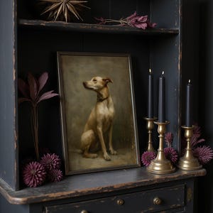 May include: A framed dog portrait sits on a dark wooden shelf, flanked by black candles in brass holders and decorative purple flowers. A gold starburst and dried floral accents adorn the top shelf, creating a vintage aesthetic.