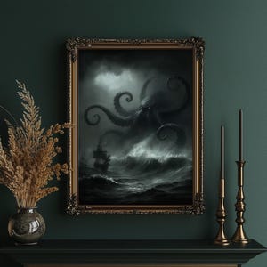 May include: A framed artwork depicts a dramatic ocean scene with a giant octopus attacking a ship in a stormy sea. The artwork is in a gold ornate frame. The color palette is primarily black, white, and gray, creating a moody and intense atmosphere.