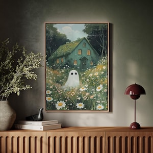 Adorable ghost in a dreamy wildflower meadow by a whimsical cottage. Perfect pastel spooky-cute canvas wall art for cozy gothic or fall decor.