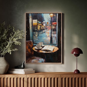 Rainy City Café Window Scene Canvas - Cozy Coffee and Open Book Art, Urban Street Lights and Reflections, Atmospheric Wall Decor