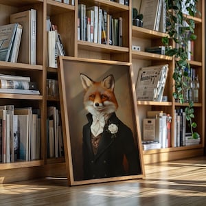 May include: A framed portrait of a fox in formal wear: a black coat, white cravat, and a rose. The fox has orange and white fur. The artwork is in a wooden frame, leaning against a bookshelf filled with books.