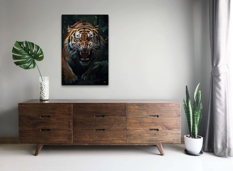 May include: A close-up of a tiger's face with its mouth open, showing its teeth. The tiger is in a dark green jungle setting.