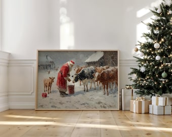 May include: A framed print depicts Santa Claus in a red suit feeding cows in a snowy landscape. The artwork features a barn in the background and a small calf. A Christmas tree with lights and ornaments stands to the right.