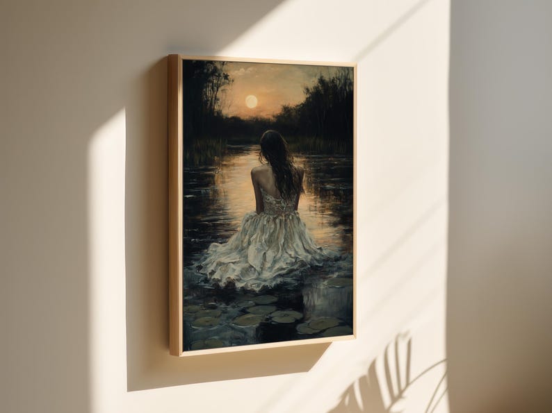 May include: A painting of a woman in a white dress sitting in a body of water with lily pads. The woman is facing away from the viewer and the setting sun is in the background.