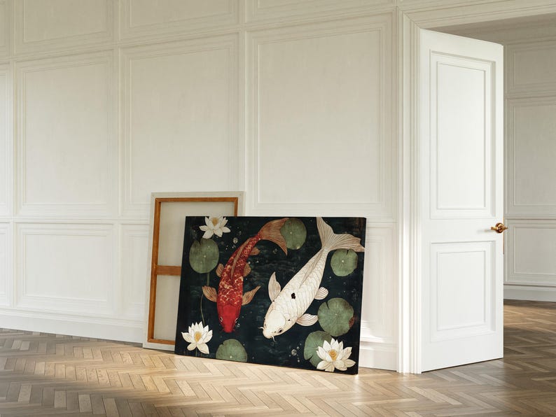 May include: A rectangular canvas print featuring two koi fish, one red and one white, swimming among lily pads and white lotus flowers. The artwork is set against a dark background, with a wooden frame visible behind it.