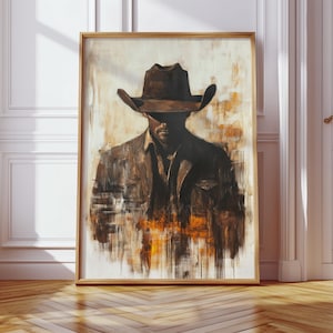 Pode incluir: Uma obra de arte emoldurada com um retrato de um cowboy. A pintura mostra um homem com chapéu e jaqueta de cowboy marrons, com um estilo abstrato e borrado. A paleta de cores inclui marrons, laranjas e brancos, criando uma estética rústica.