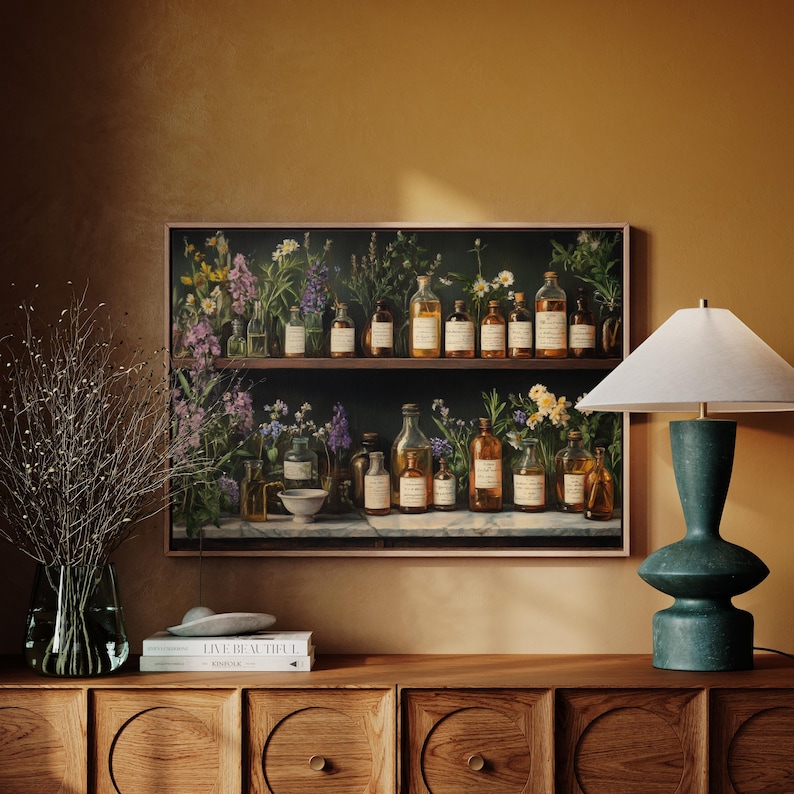 A vintage oil painting of an apothecary shelf filled with antique glass bottles, herbal tinctures, and wildflowers. This dark academia-inspired botanical print is perfect for herbalists, cottagecore lovers, and those who adore rustic pharmacy decor. A timeless touch of old-world charm.
