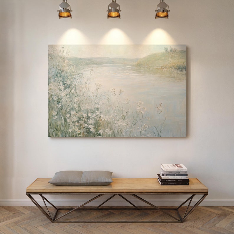 Immerse in serenity with this tranquil lake canvas art featuring soft pastel tones, delicate white wildflowers, and serene waters. Perfect for creating a calming ambiance in your living space or bedroom with its minimalist and elegant design.
