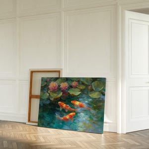 May include: An original oil painting on canvas depicting koi fish swimming in a pond with lily pads and pink flowers. The artwork is displayed in a bright room with a wooden floor and white walls.