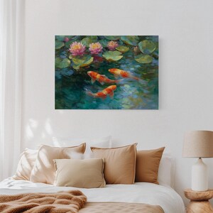 May include: A canvas print depicting a serene pond scene. The artwork features vibrant orange koi fish swimming beneath pink water lilies and green lily pads. The water is a mix of blues and greens, creating a tranquil atmosphere.