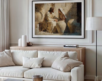 May include: A framed print depicts two figures in religious attire seated near large clay pots. The artwork, rendered in warm, earthy tones, is displayed above a light-colored wooden cabinet and a white sofa with beige pillows.