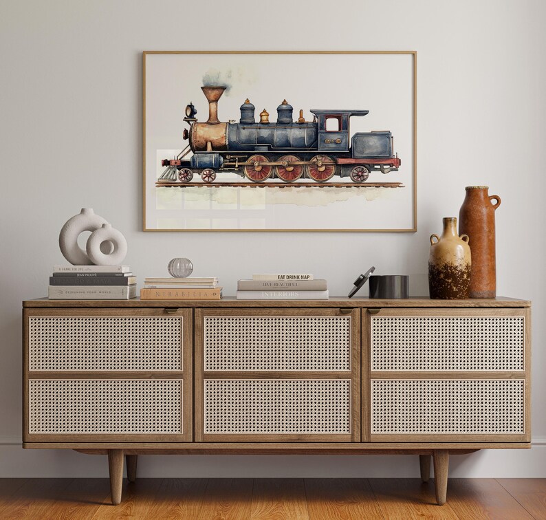 May include: A watercolor painting of a vintage steam locomotive train with red, blue, and brown details. The train is on a white background with a light blue wash.