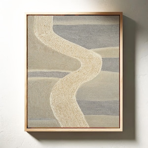 May include: Abstract art print in a natural wood frame. The artwork features a winding, dotted path in cream against a backdrop of muted grey and beige horizontal bands. The overall aesthetic is minimalist and earthy.